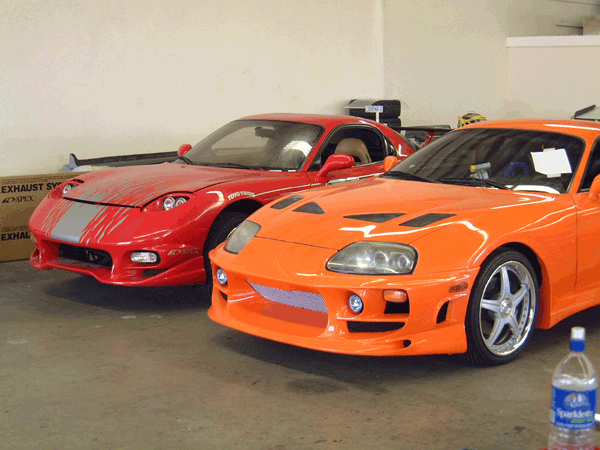 Orange Toyota Supra & Red Mazda RX-7.gif
